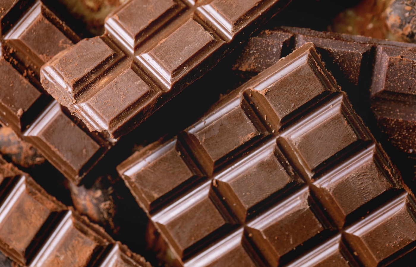 a pile of chocolate bars sitting on top of each other.