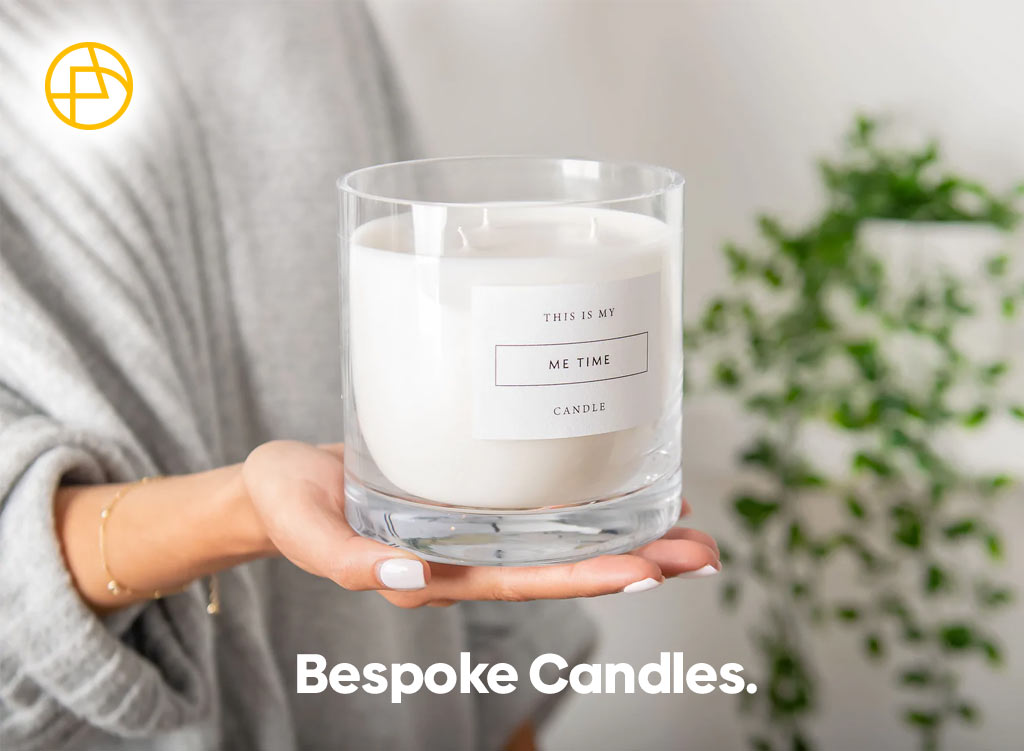 A white candle with a bespoke message on the front